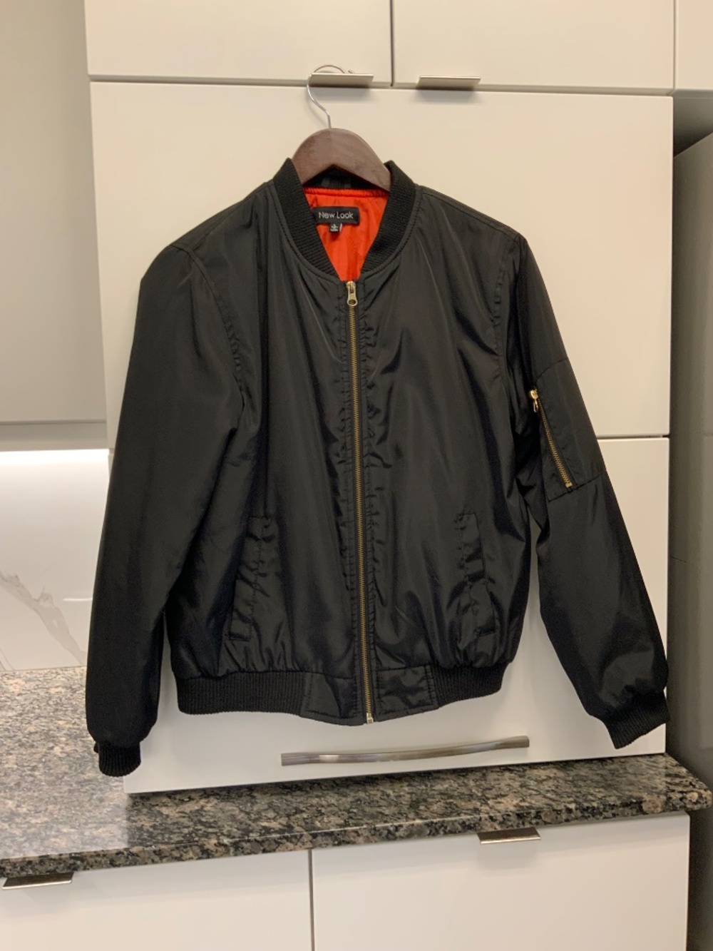 Black lines aviator jacket with gold zipper, size Medium